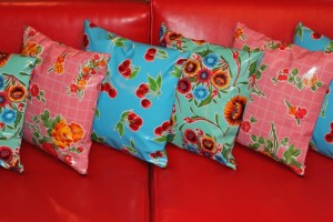 mexican-oil-cloth-pillows-red-sofa